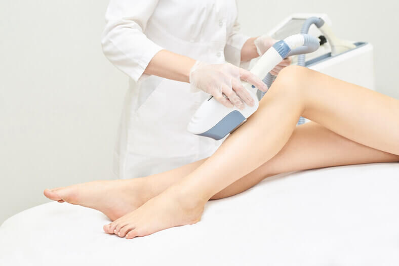 Laser hair removal on woman's leg
